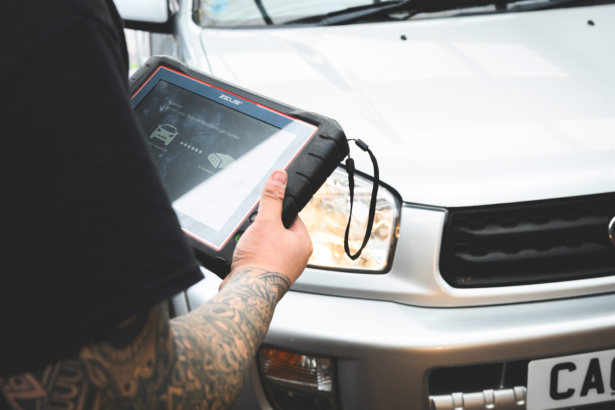 Technician carrying out computer diagnostics and engine fault isolation at Langdon Motors