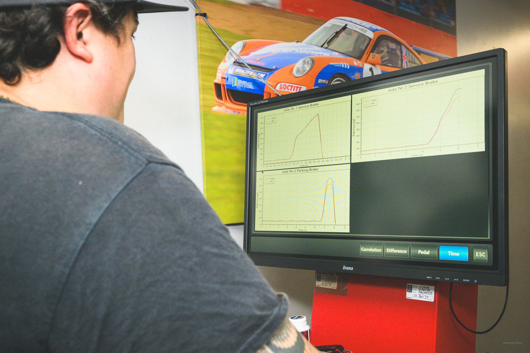 Liam inspecting a vehicle using the automated MOT testing equipment at Langdon Motors