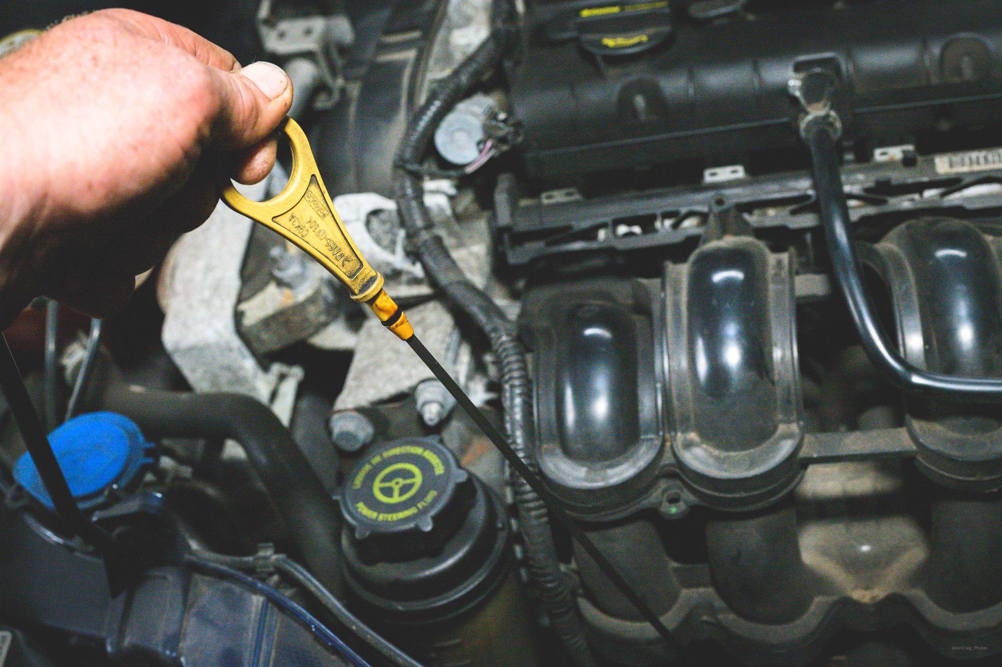 Langdon Motors technician performing scheduled vehicle servicing in the workshop