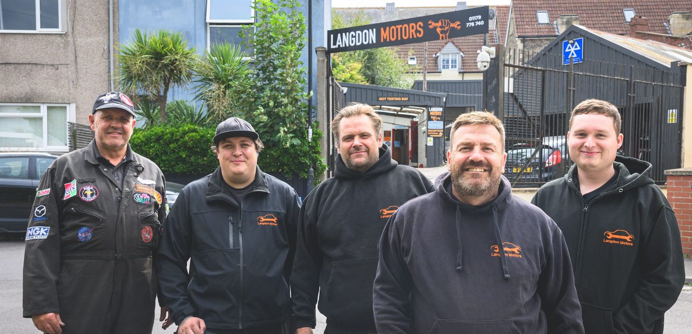 The Langdon Motors workshop team together in the garage